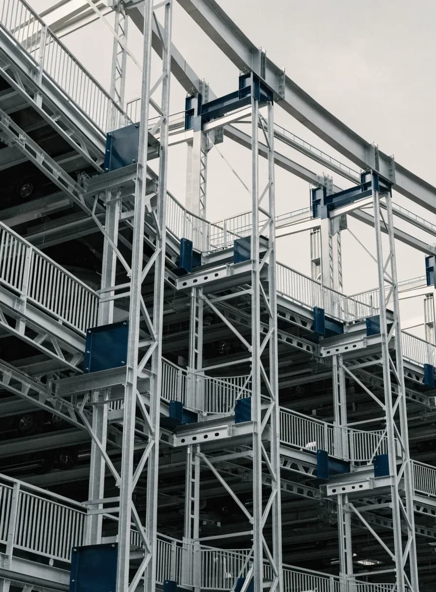 Automated multi-level mechanical car parking system with stacked vehicle platforms in a galvanised steel lattice structure
