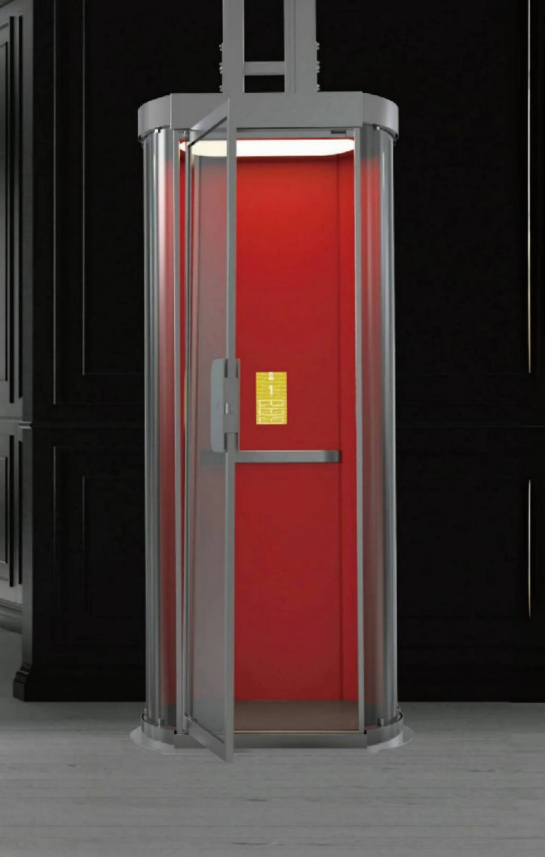 Home elevator pintar tanpa shaft yang berdiri bebas di ruangan berpanel gelap, kabin oval berkaca dengan panel belakang merah dan pintu berengsel